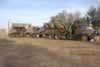 The M3 Israeli Halftrack and M113A2 Prototype vehicles of the Australian Army Tank Museum aboard a Mack Freightliner for their return to Puckapunyal. The Mack is equipped with a side-loading crane and is towing a 20 tonne Plant Trailer. 